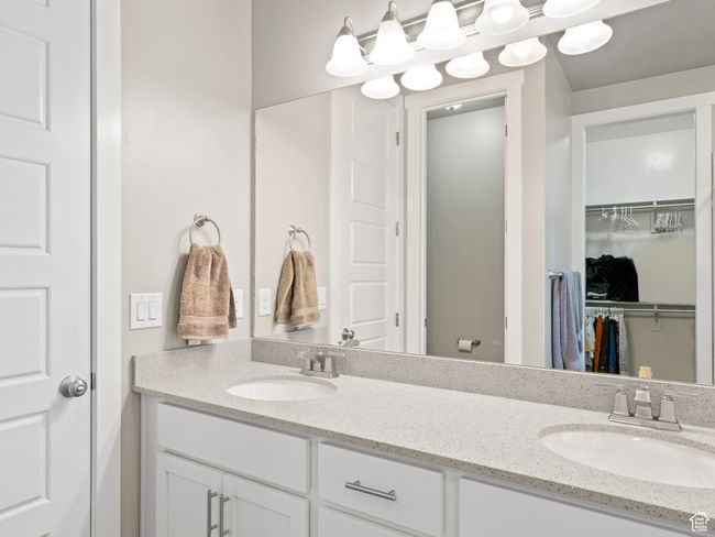Full bathroom featuring double vanity and a spacious closet | Image 16