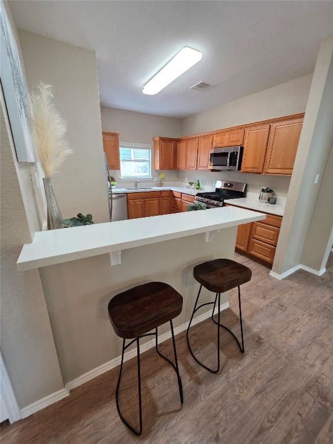 Kitchen featuring stainless steel appliances | Image 10