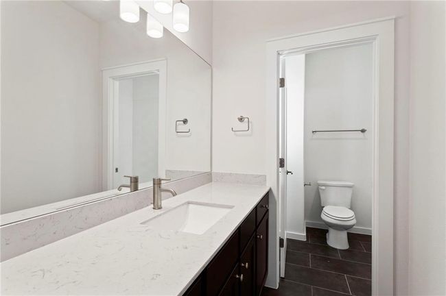 Bathroom with vanity and tile patterned flooring | Image 24