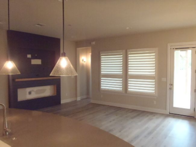 Unfurnished living room with wood finished floors and plenty of natural light | Image 21