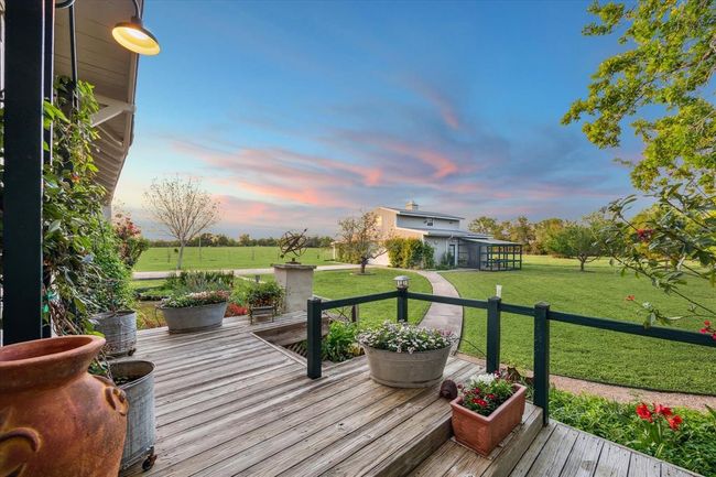 View of the side porch overlooking the garage. | Image 37