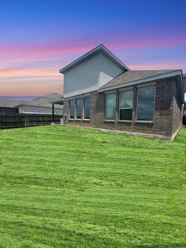 Rear view of property with brick siding | Image 14