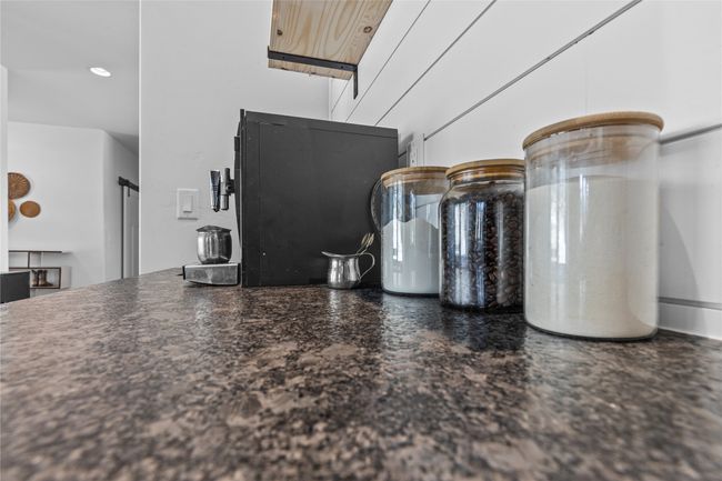 Room details featuring dark countertops | Image 10