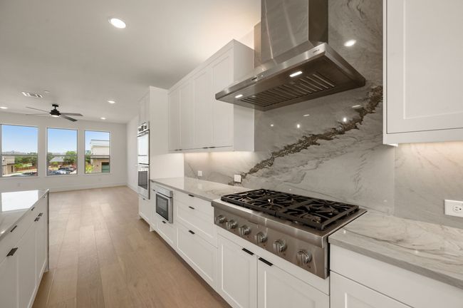 Featuring top of the line appliances, beautiful cabinetry and fantastic finishes, any chef would be proud to call this kitchen their own! | Image 12