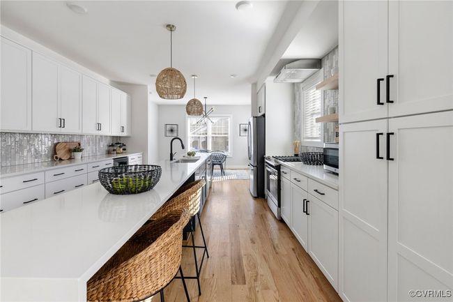 Bar seating at kitchen island. | Image 12