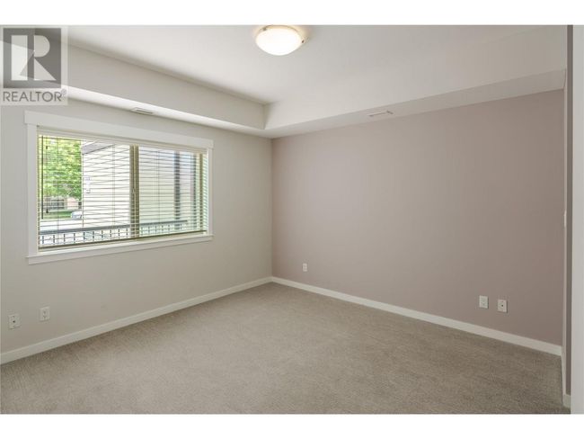 101 - 1957 Kane Rd, Condo with 1 bedrooms, 2 bathrooms and 1 parking in Kelowna BC | Image 8