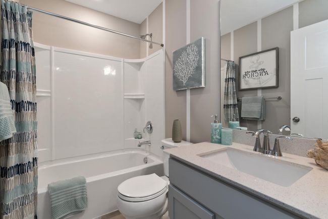 (Photo of decorated model, actual home's finishes will vary) A full bath located on the main floor! | Image 18