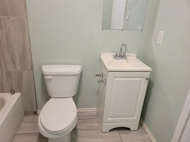 Full bathroom with vanity and tile patterned floors | Image 21