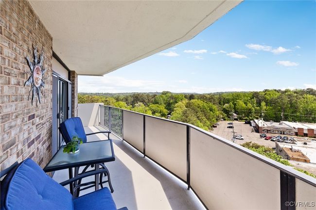 Balcony featuring a view of trees | Image 22