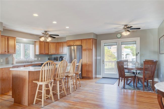 Kitchen and dining are with slider to back deck | Image 9