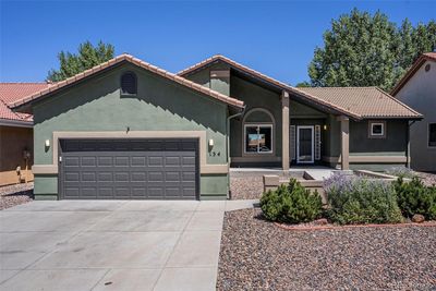 Newly painted stucco home with Spanish tile roof (just 5 years old); xeriscaped front yard, all maintained | Image 2