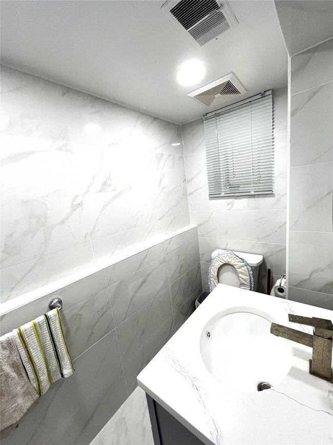 Bathroom featuring vanity and tile walls | Image 16