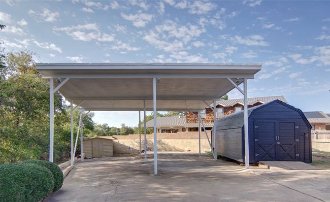 Additional parking with RV height cover; portable storage building. | Image 32