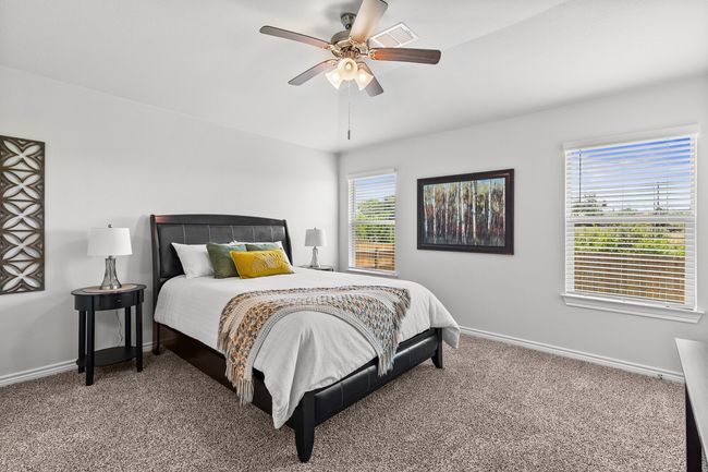 Carpeted bedroom with baseboards and a ceiling fan | Image 22
