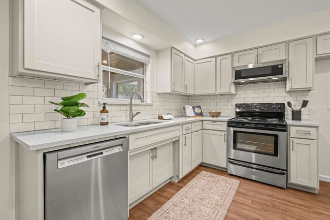 The kitchen aesthetic is modern, yet timeless. | Image 11