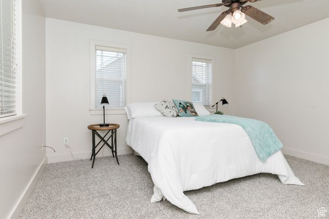 Bedroom featuring carpet flooring and a ceiling fan | Image 11