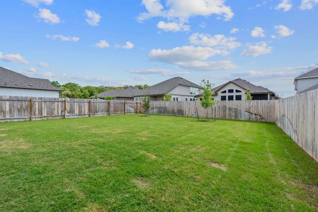 View of yard with a fenced backyard | Image 25
