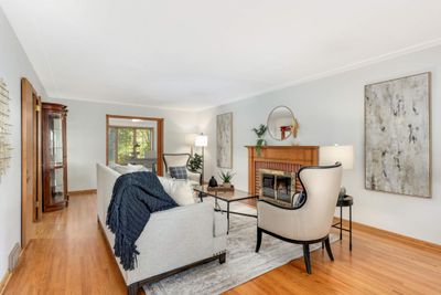 As you enter the home, you are greeted with a living room with beautiful hardwood floors. | Image 2