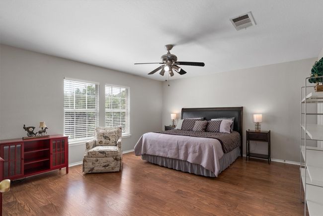 Great size secondary bedroom with room for a sitting area, great natural lighting, and walk in closet | Image 32