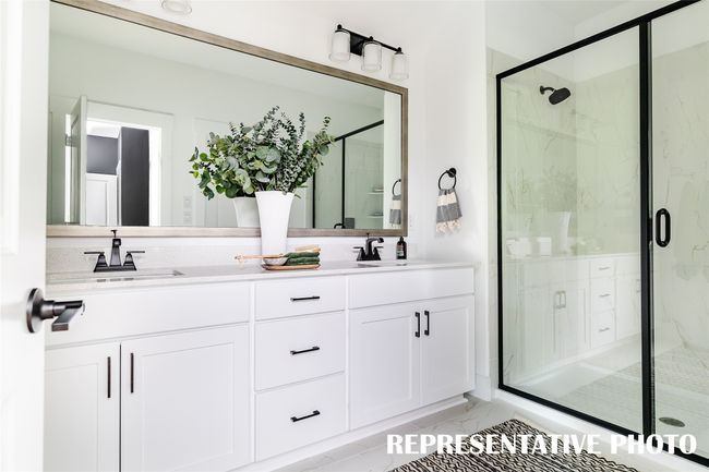 Our thoughtfully designed owner's baths offer style and space for two. REPRESENTATIVE PHOTO OF MODEL HOME | Image 8