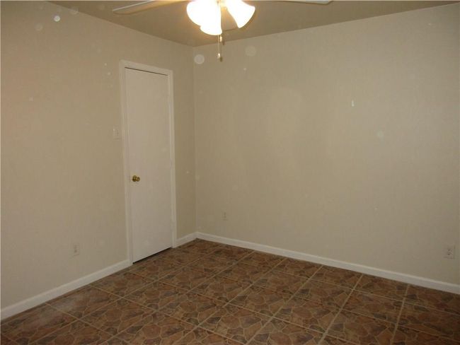 Empty room featuring ceiling fan | Image 5