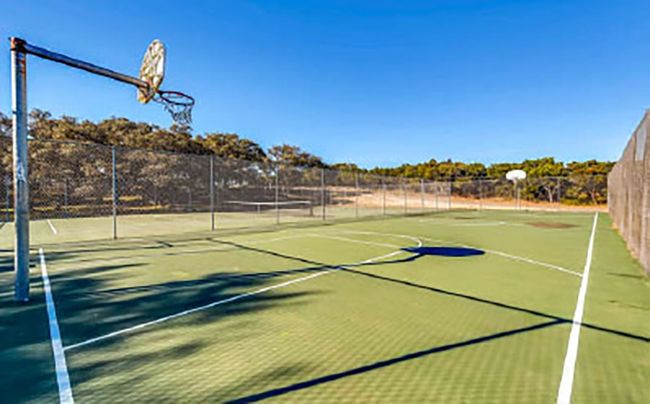 View of basketball court featuring community basketball court and fence | Image 9