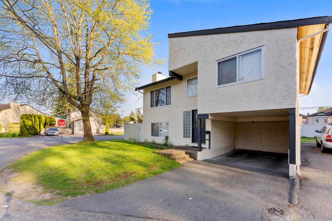 View of front of house with a chimney, stucco siding, and a front lawn | Image 5