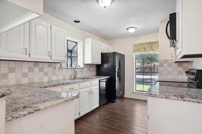 710 Cimarron Trl, House other with 3 bedrooms, 2 bathrooms and null parking in Irving TX | Image 4