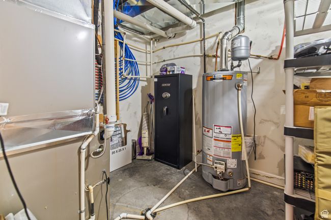 Utilities featuring gas water heater | Image 80