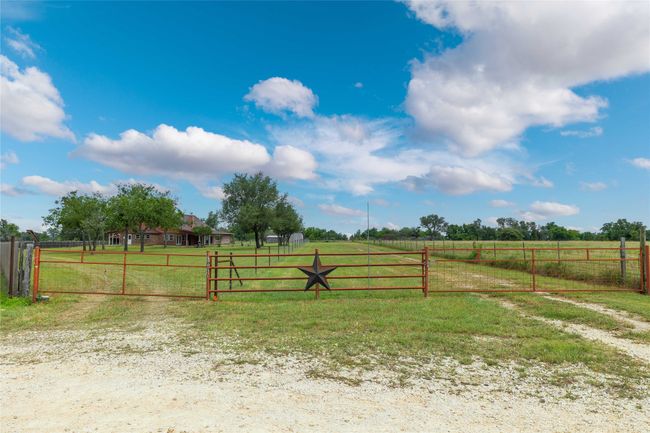 View of yard featuring a view of rural / pastoral area and a gate | Image 30
