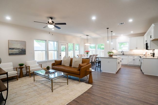 Living area featuring ceiling fan, dark wood finished floors, and recessed lighting | Image 14