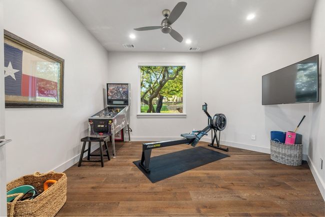 Exercise area with baseboards, recessed lighting, visible vents, ceiling fan, and wood finished floors | Image 19