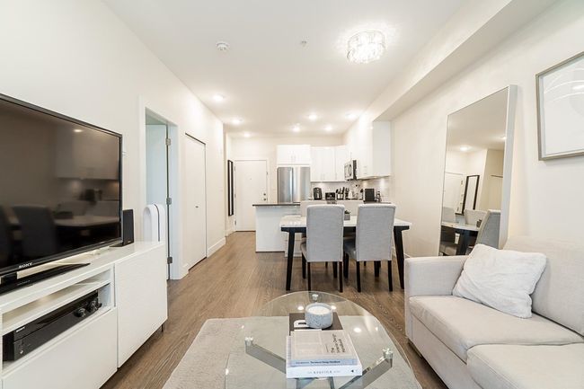 Living room featuring wood finished floors | Image 10