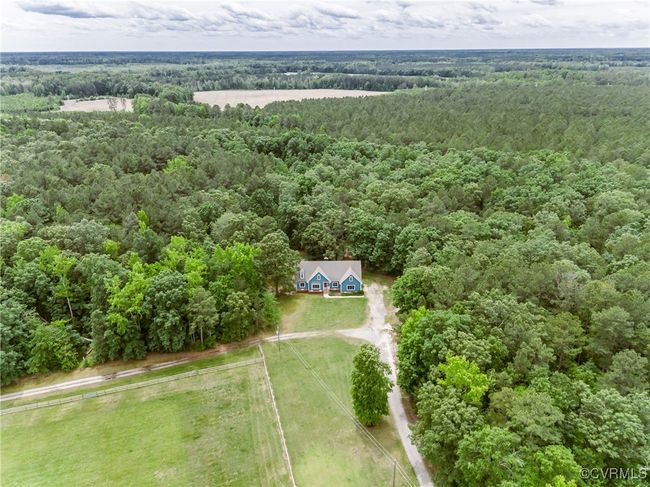 View of subject property featuring a heavily wooded area | Image 5