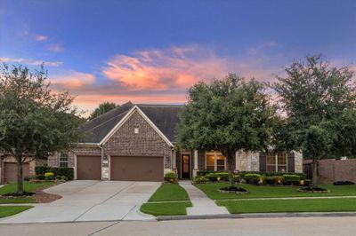 Don't miss the opportunity to make this beautiful 1.5 story, 5 bed, 4.5 bath, 3 car garage home located on a corner lot with no back or side neighbors yours! | Image 1