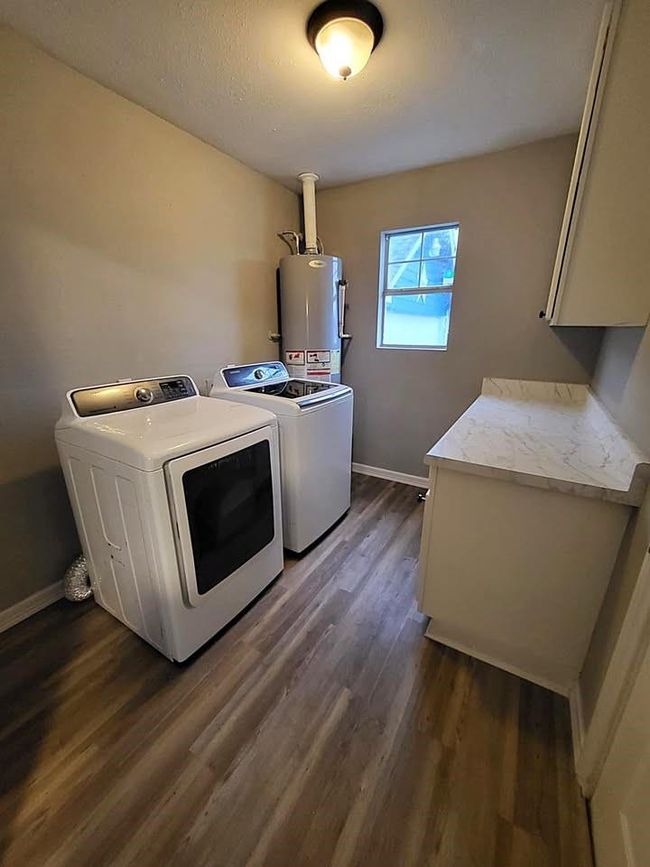 Utility/mud room with extra storage; washer & dryer included | Image 19