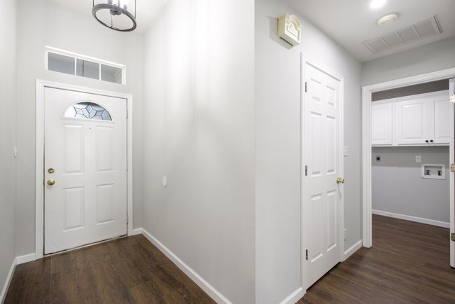 Entrance foyer featuring dark wood-type flooring | Image 11