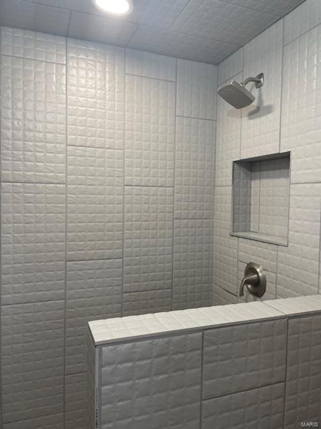 Bathroom with tile patterned flooring and a shower | Image 5