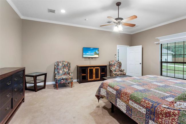 Neutral paint throughout this home. Recessed lighting, ceiling fans and crown molding throughout. | Image 19