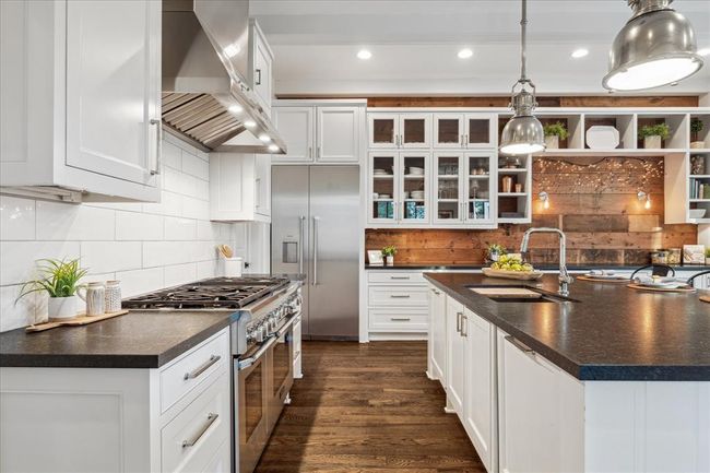 KITCHEN. Thermador 6 burner gas range and vent hood. Clever, functional "triangle" design with quick access to the pantry, sink and refrigerator. | Image 8