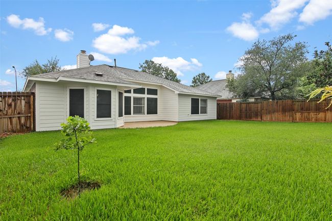 The backyard has plenty of space for the kids and pets to play. Even planted a new tree. | Image 22