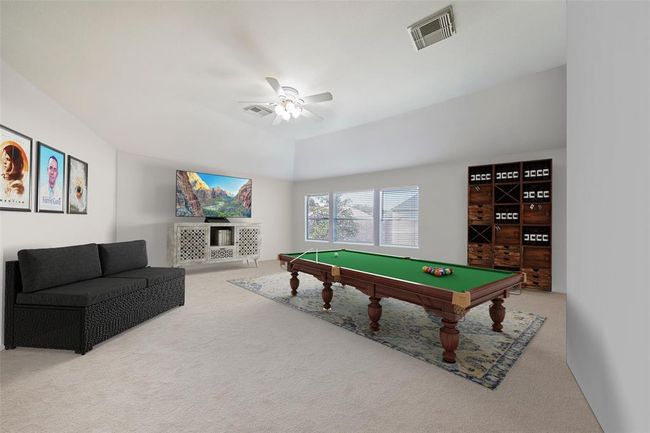 Large upstairs game room. The possibilities are endless here. It has a full shower attached. Digitally staged | Image 6
