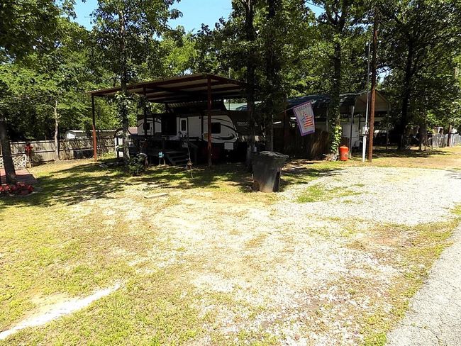 View of yard featuring a carport covering for your rv or boat | Image 26