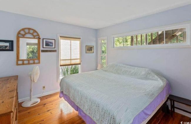 Bedroom with wood finished floors and baseboards | Image 14