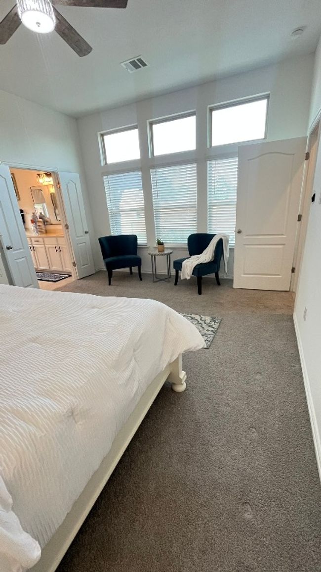 Bedroom featuring carpet flooring, a ceiling fan, and baseboards | Image 19
