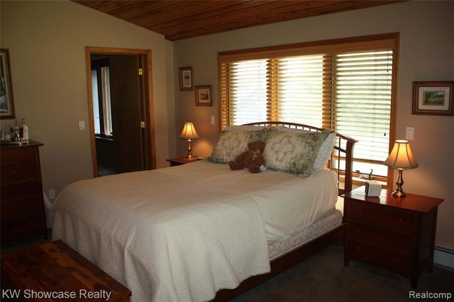 Master bedroom, with door to bathroom. | Image 25