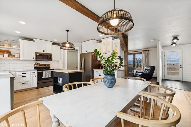 Dining area with recessed lighting and light wood-style floors | Image 17