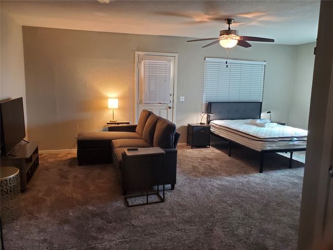 Carpeted bedroom featuring baseboards | Image 15