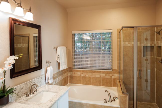 Full bath with vanity, a bath, and a stall shower | Image 13