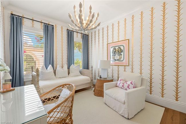 Sitting room with wallpapered walls, a wealth of natural light, a chandelier, and baseboards | Image 32